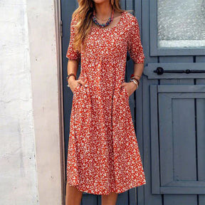 BioBlüte® - Blütenrausch a red midi dress with floral details