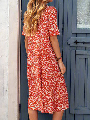 BioBlüte® - Blütenrausch a red midi dress with floral details